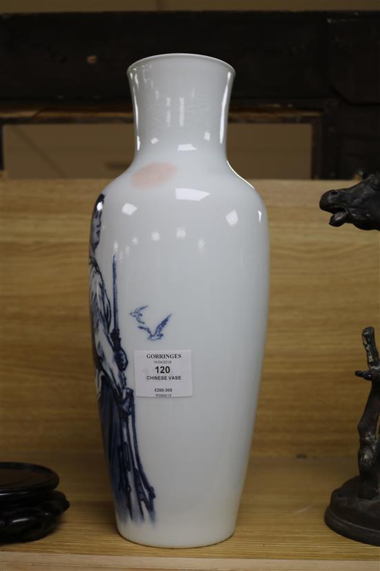 A Chinese blue and white vase, Mao Tse Tsung poem 1966 hidden within the body of the vase, wood stand height 37cm